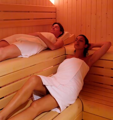 a couple of women in a sauna