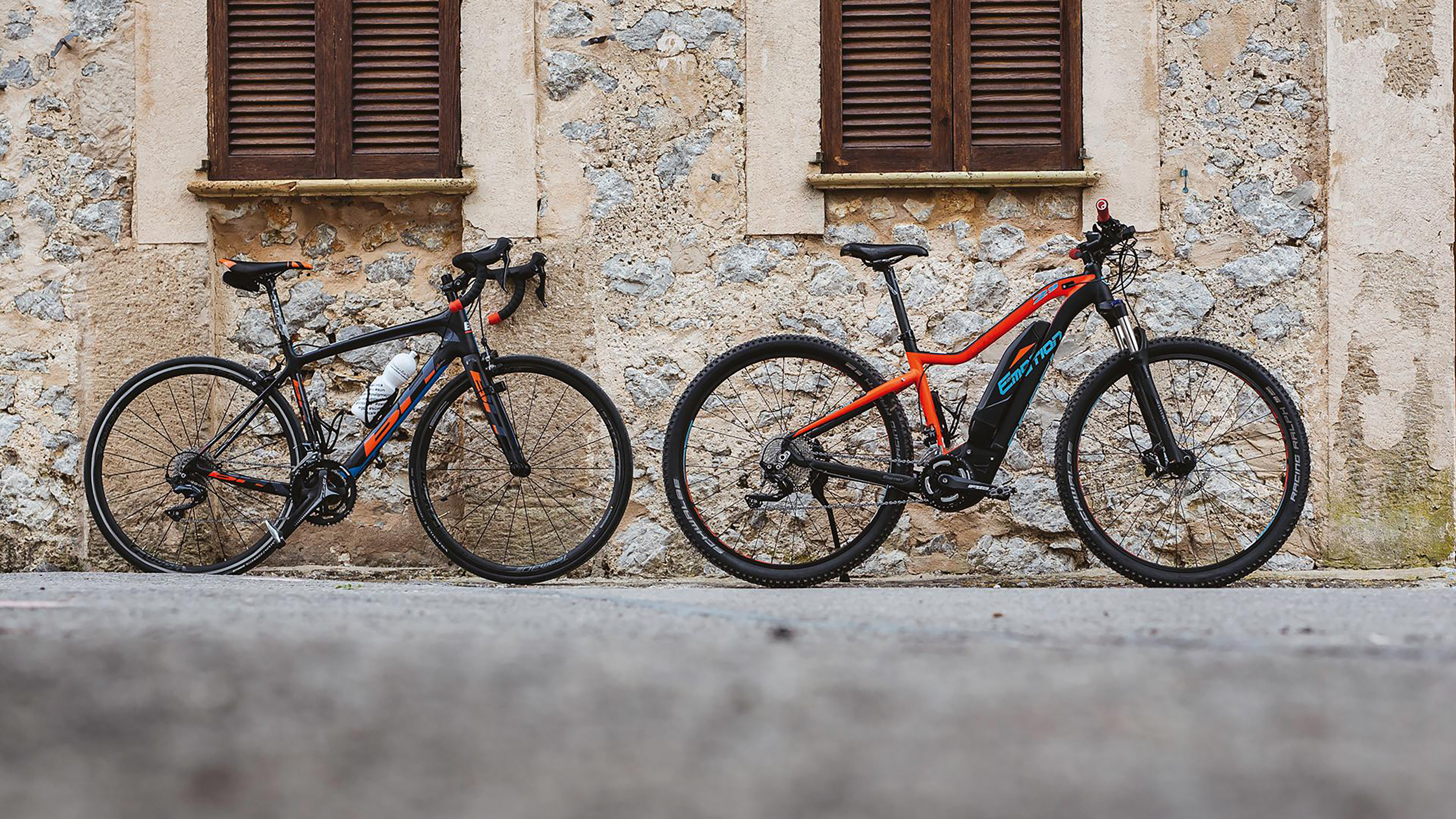 two bicycles parked next to each other