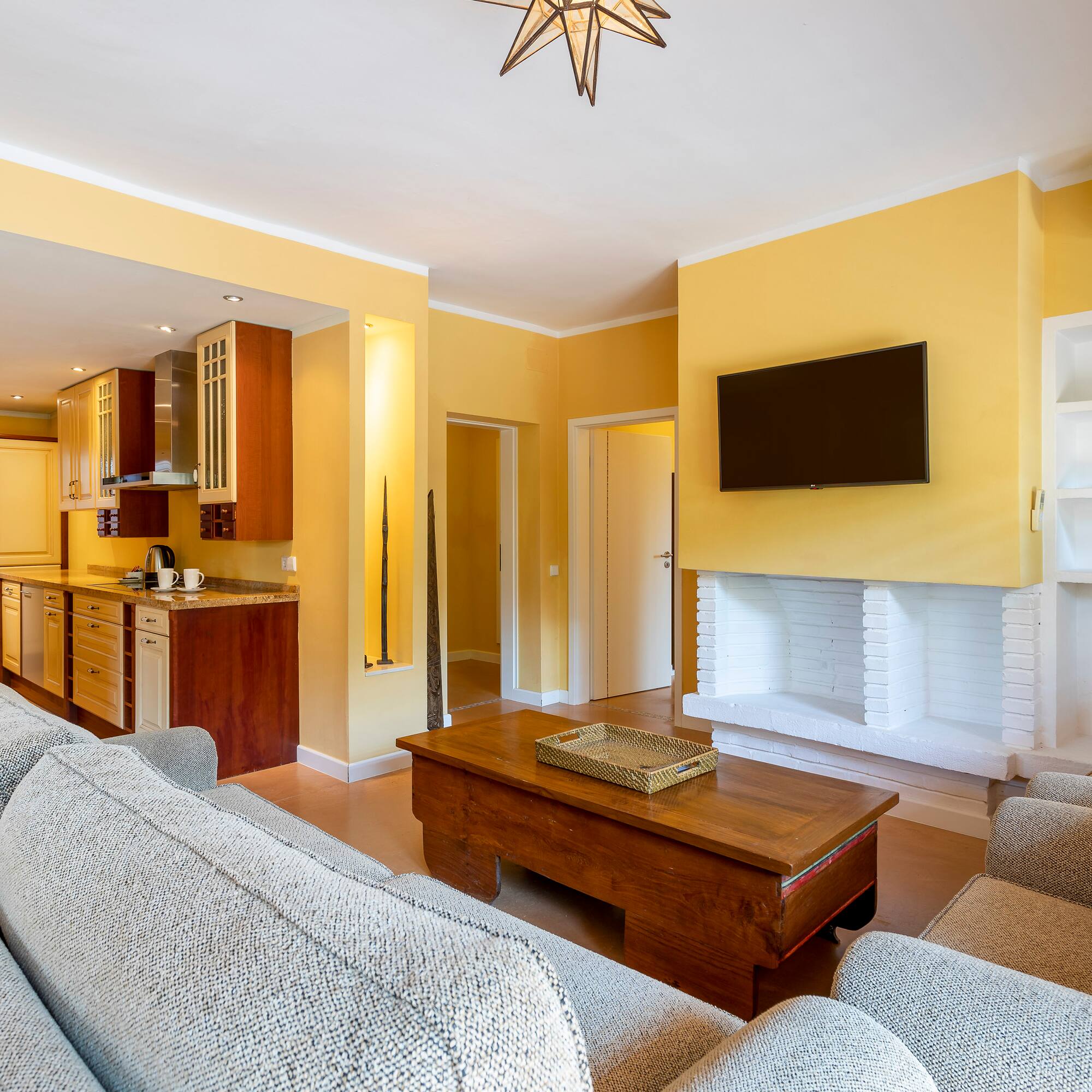 a living room with a television and a couch