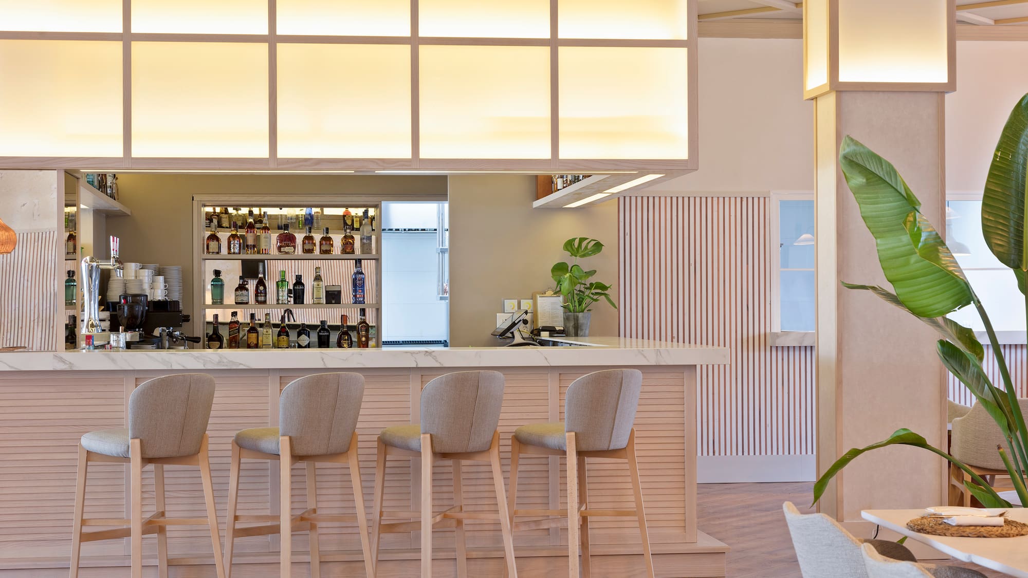 a bar with chairs and a counter