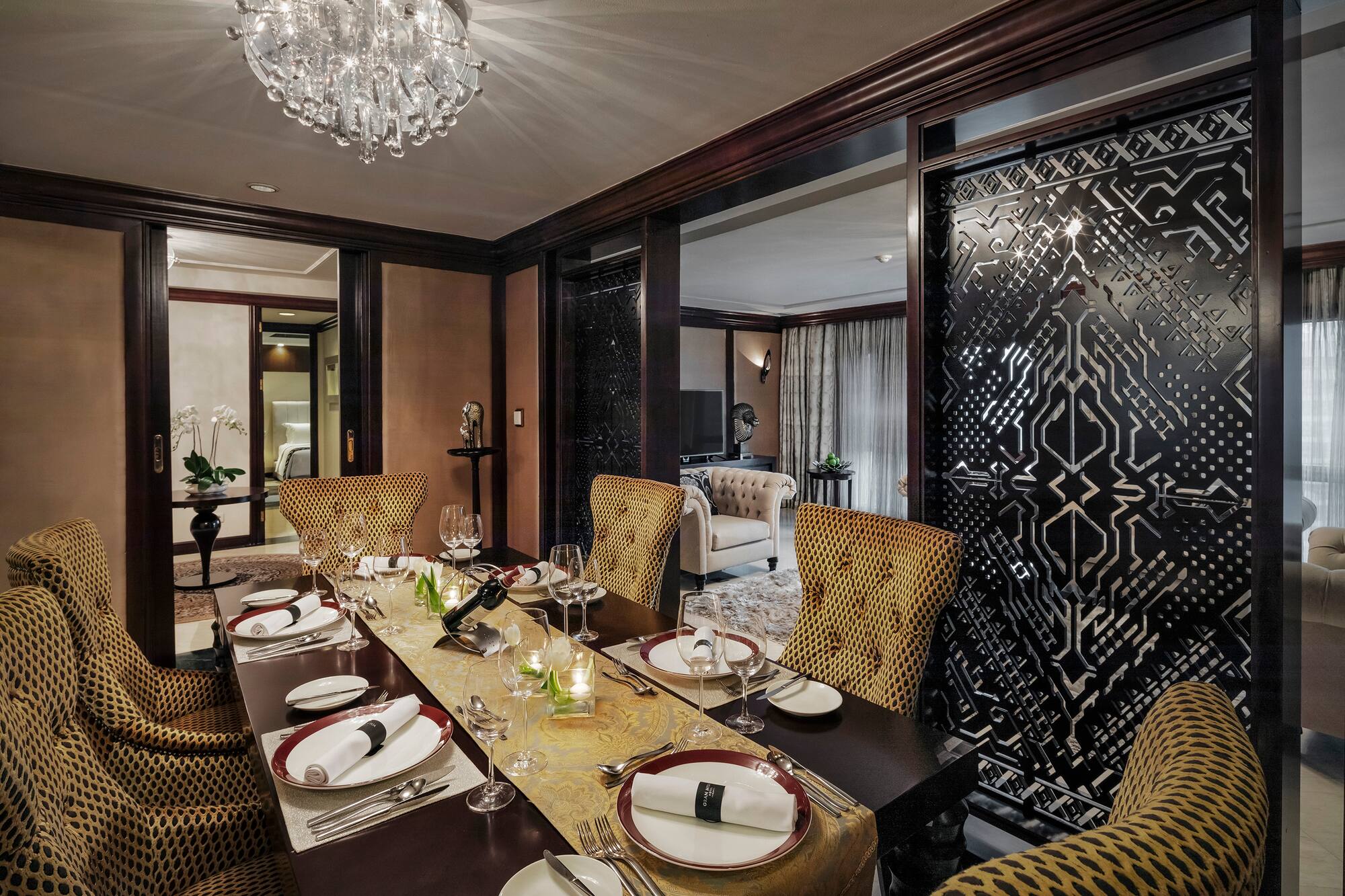 a dining table with plates and glasses