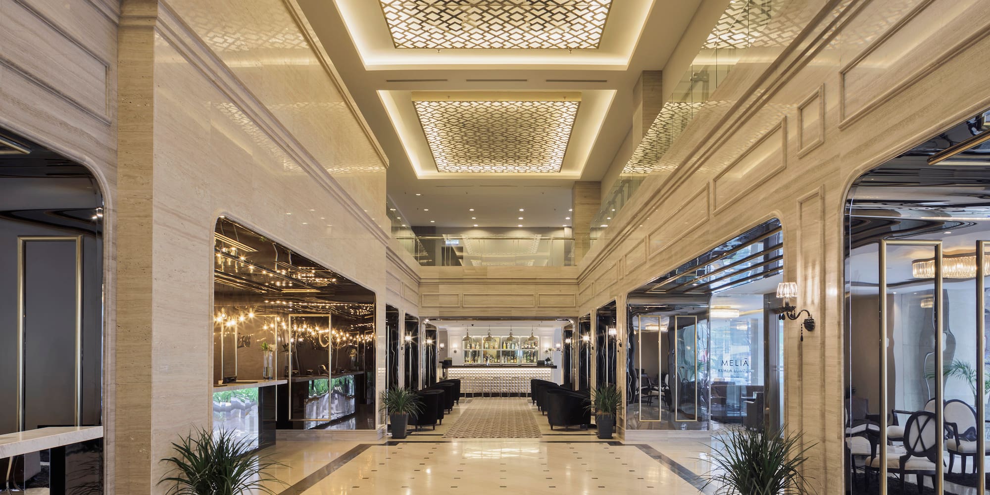 a large hall with a large ceiling and plants