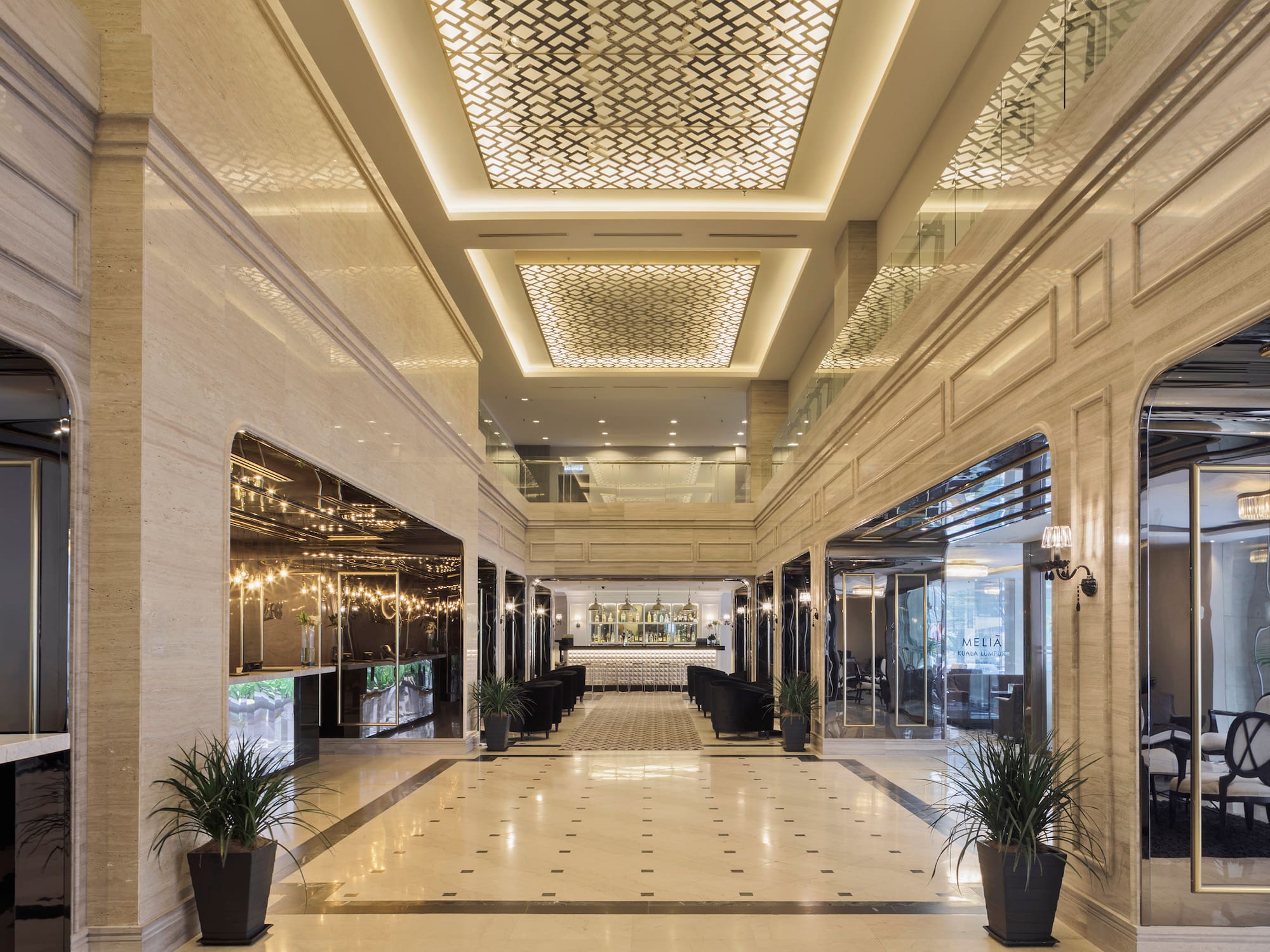 a large hall with a large ceiling and plants