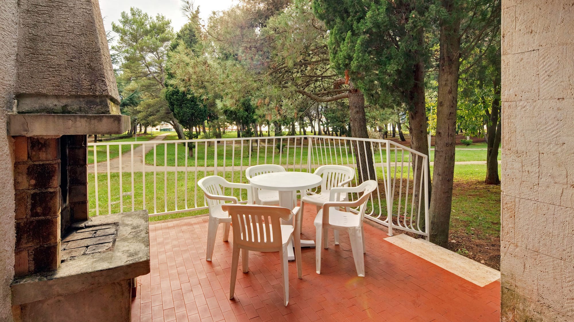 a patio with a table and chairs