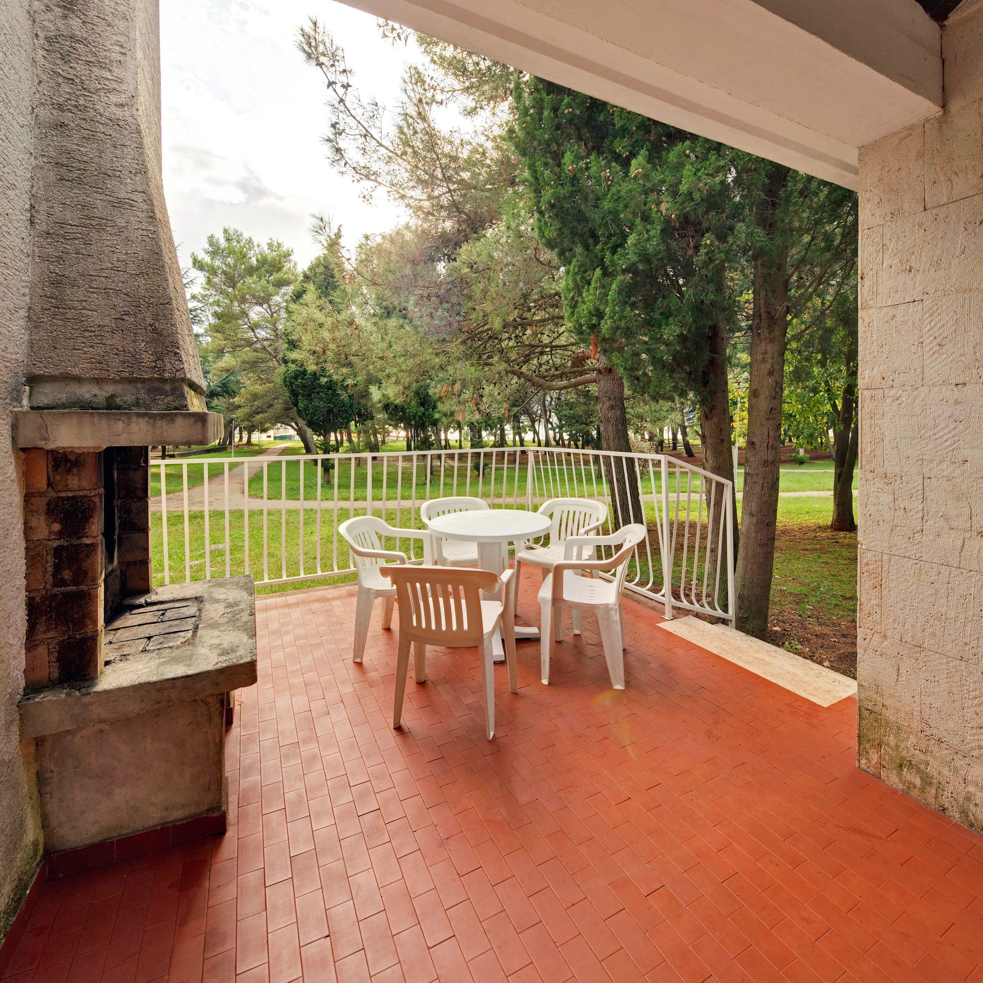 a patio with a table and chairs