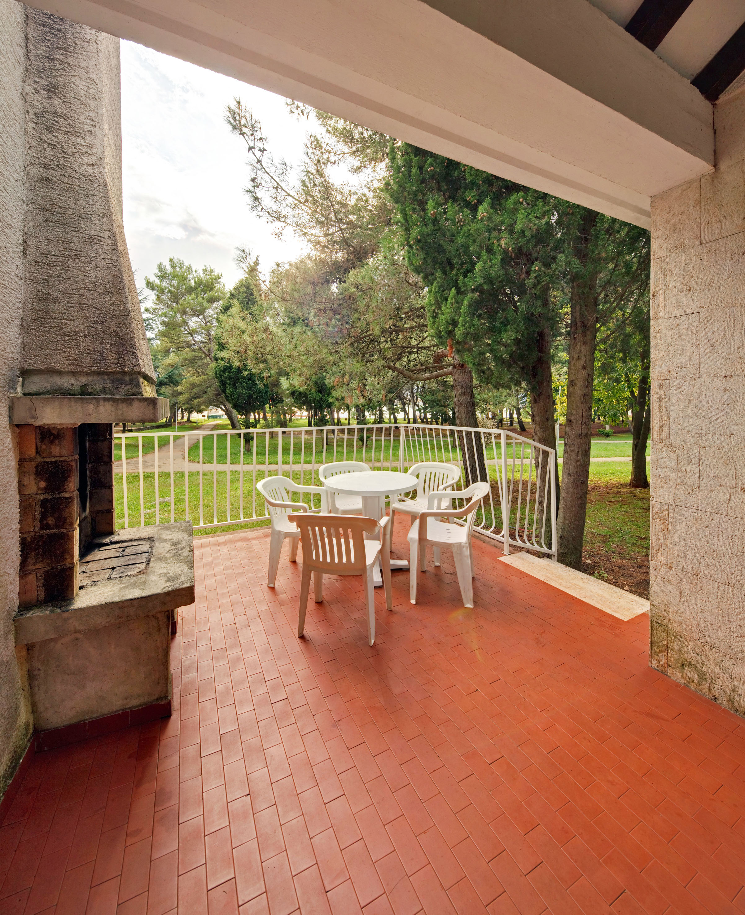 a patio with a table and chairs