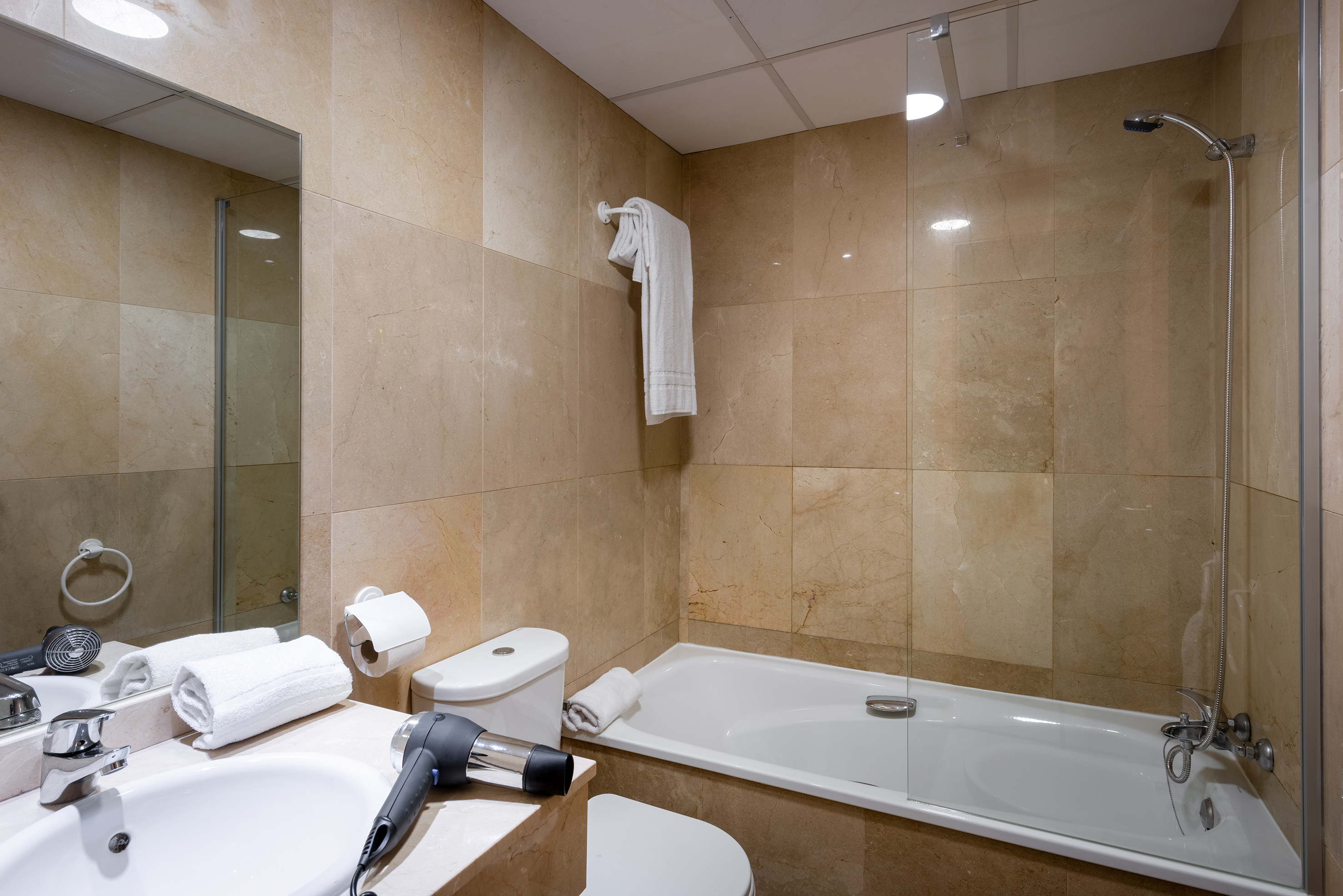 a bathroom with a bathtub and a sink
