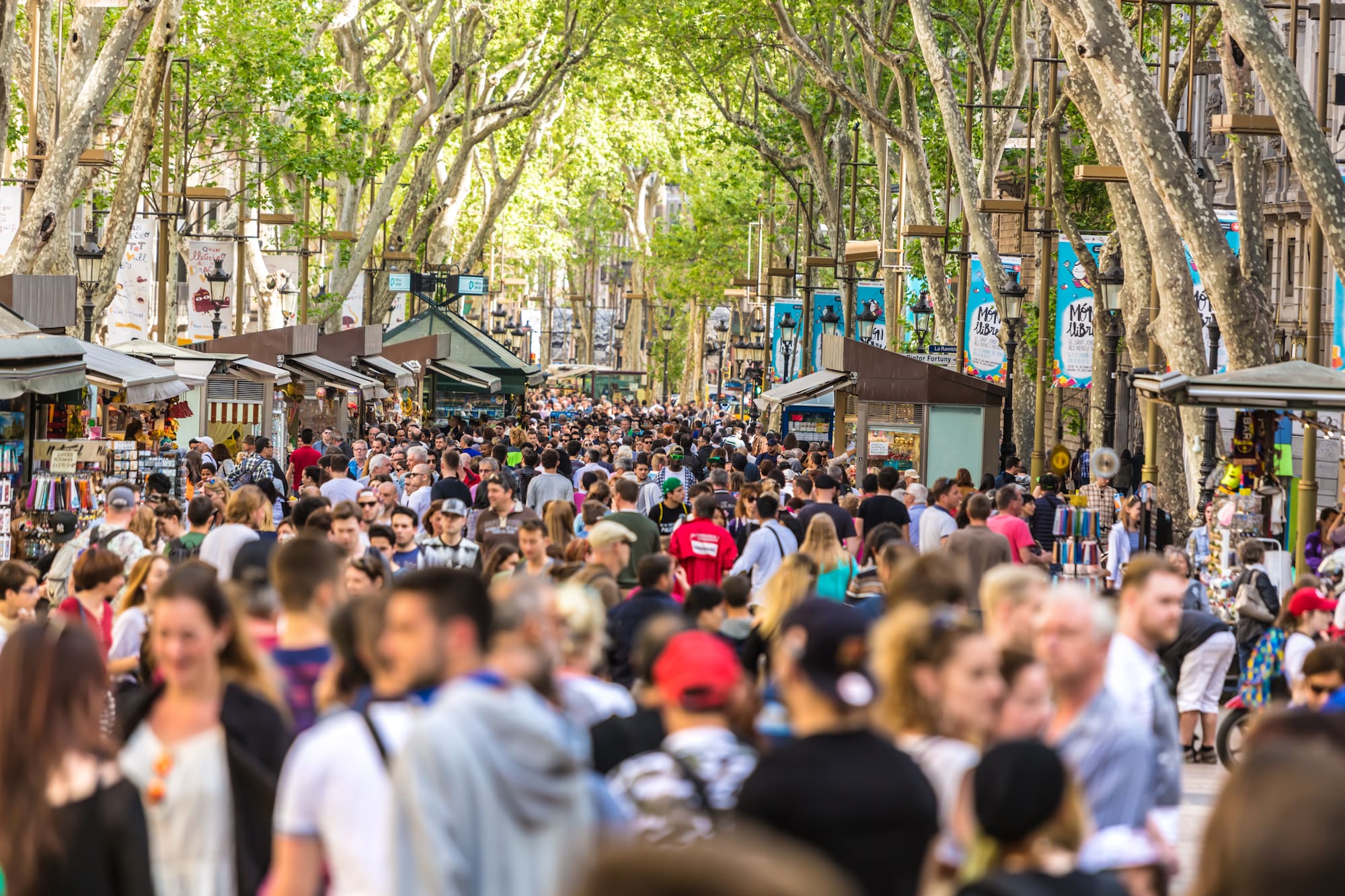 a crowd of people walking down a street