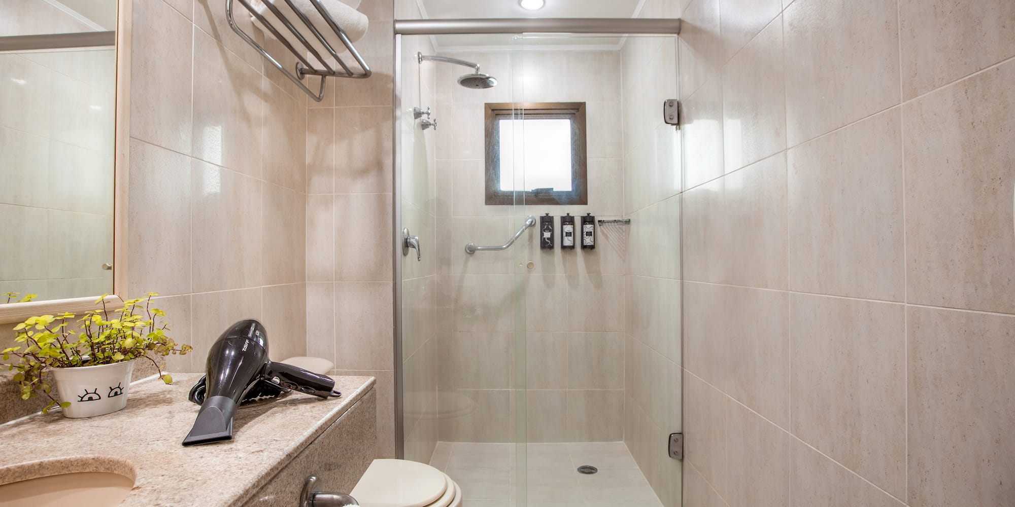 a bathroom with a shower and a sink