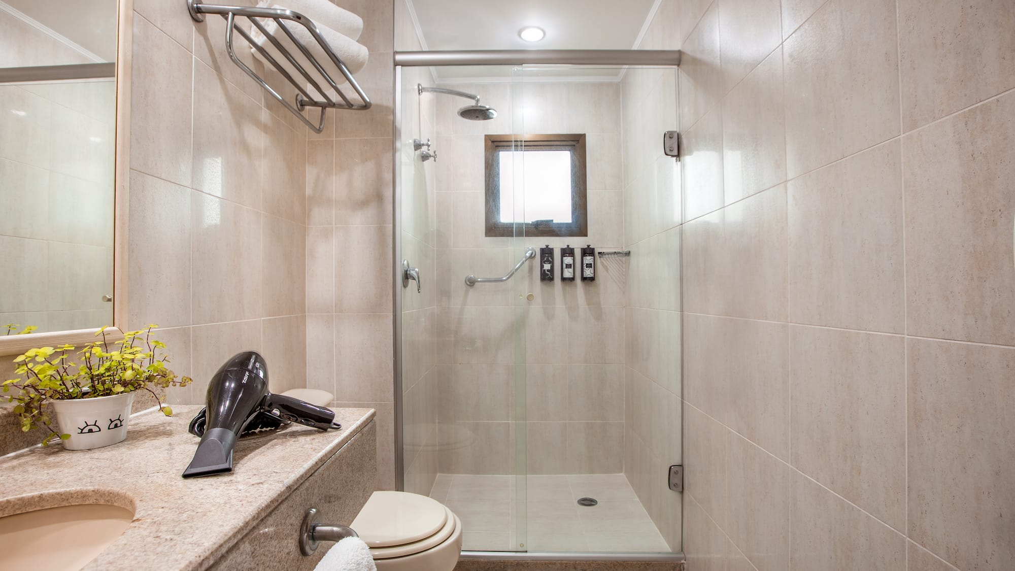 a bathroom with a shower and a sink