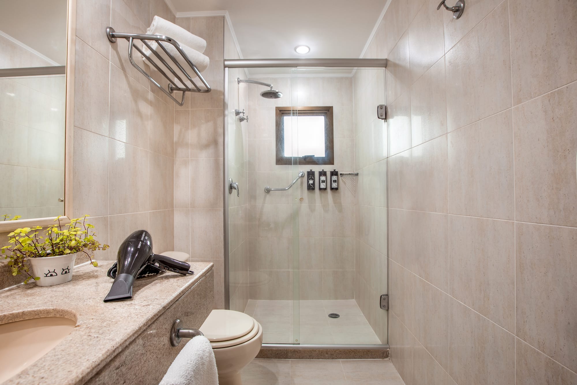 a bathroom with a shower and a sink