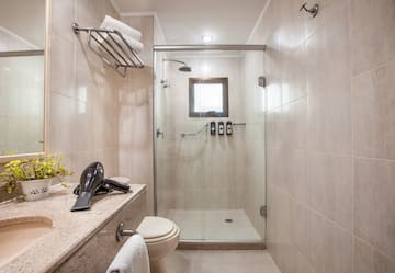 a bathroom with a shower and a sink