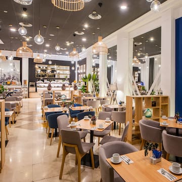 a restaurant with tables and chairs