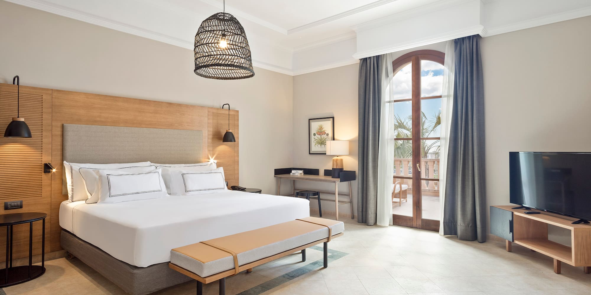 a bedroom with a bed and a bench