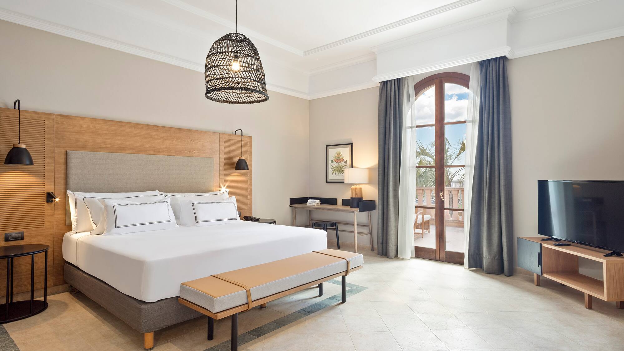 a bedroom with a bed and a bench