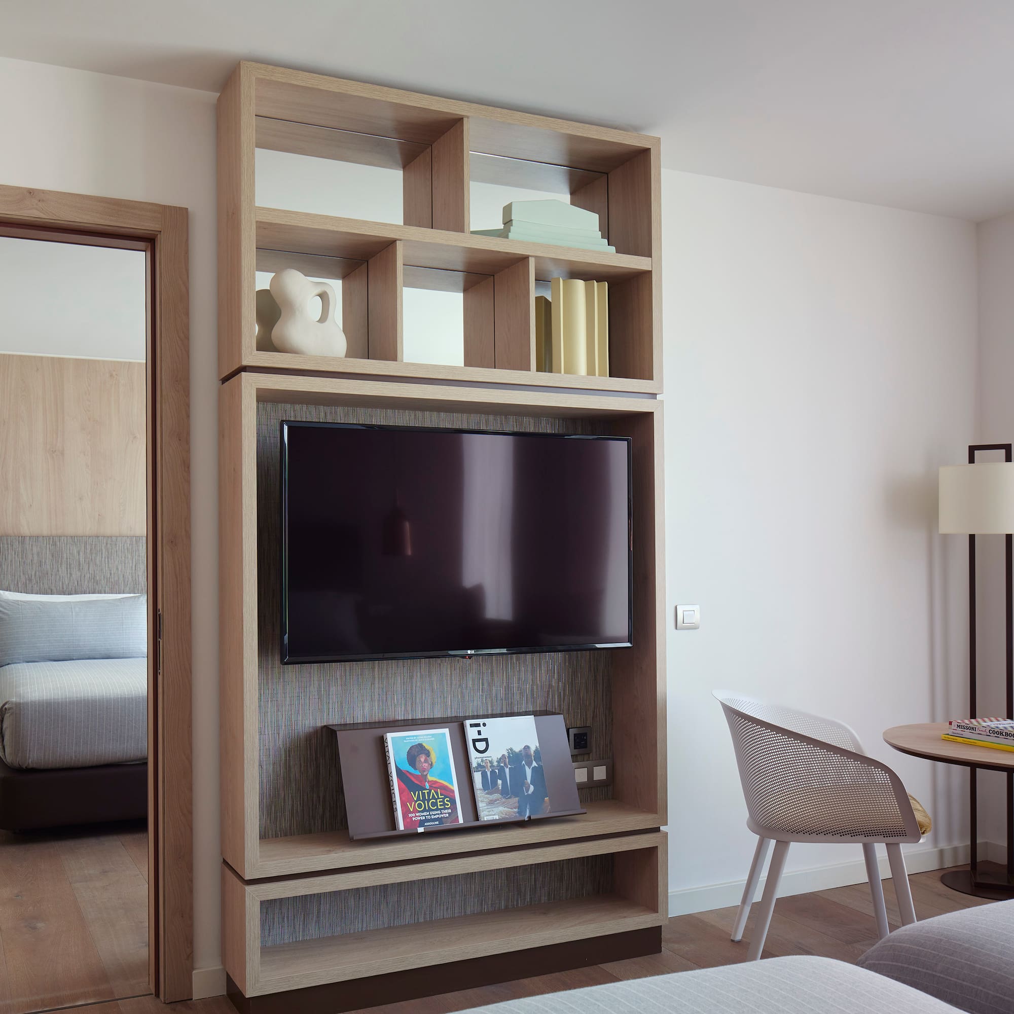 a tv on a shelf in a room