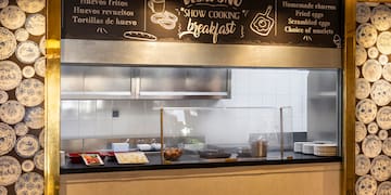 a kitchen with a sign above it