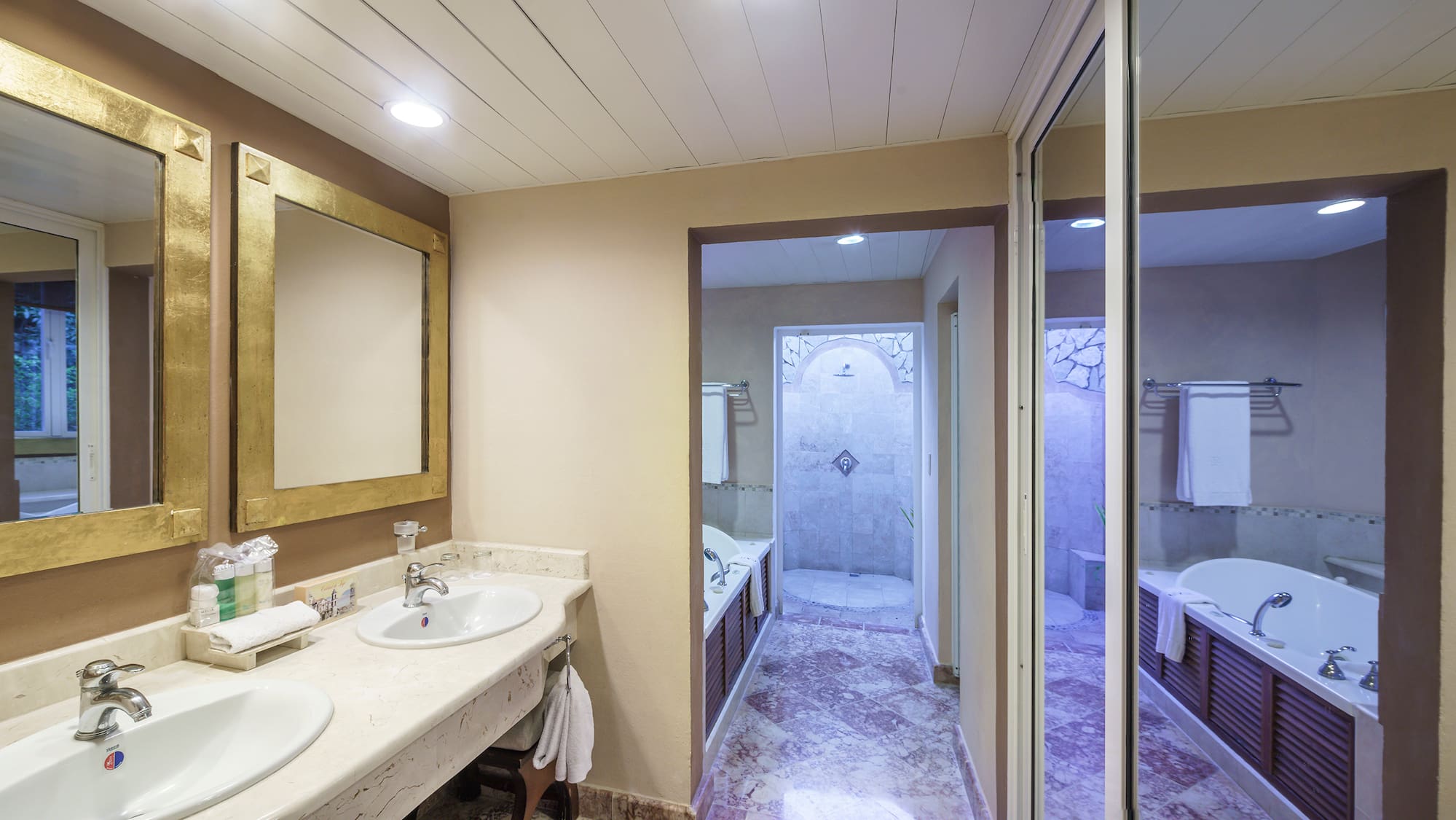 a bathroom with marble floor and sink