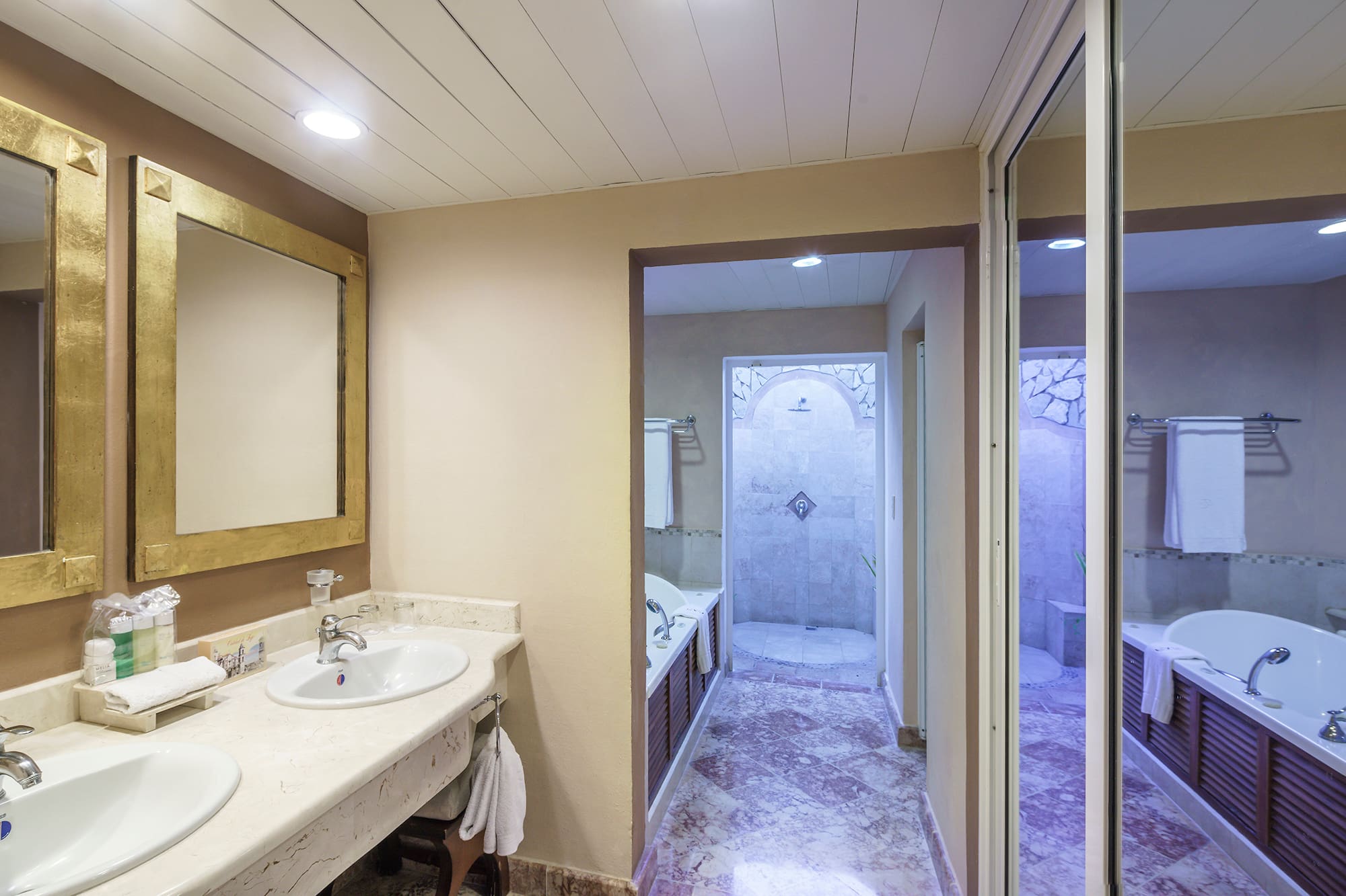 a bathroom with marble floor and sink