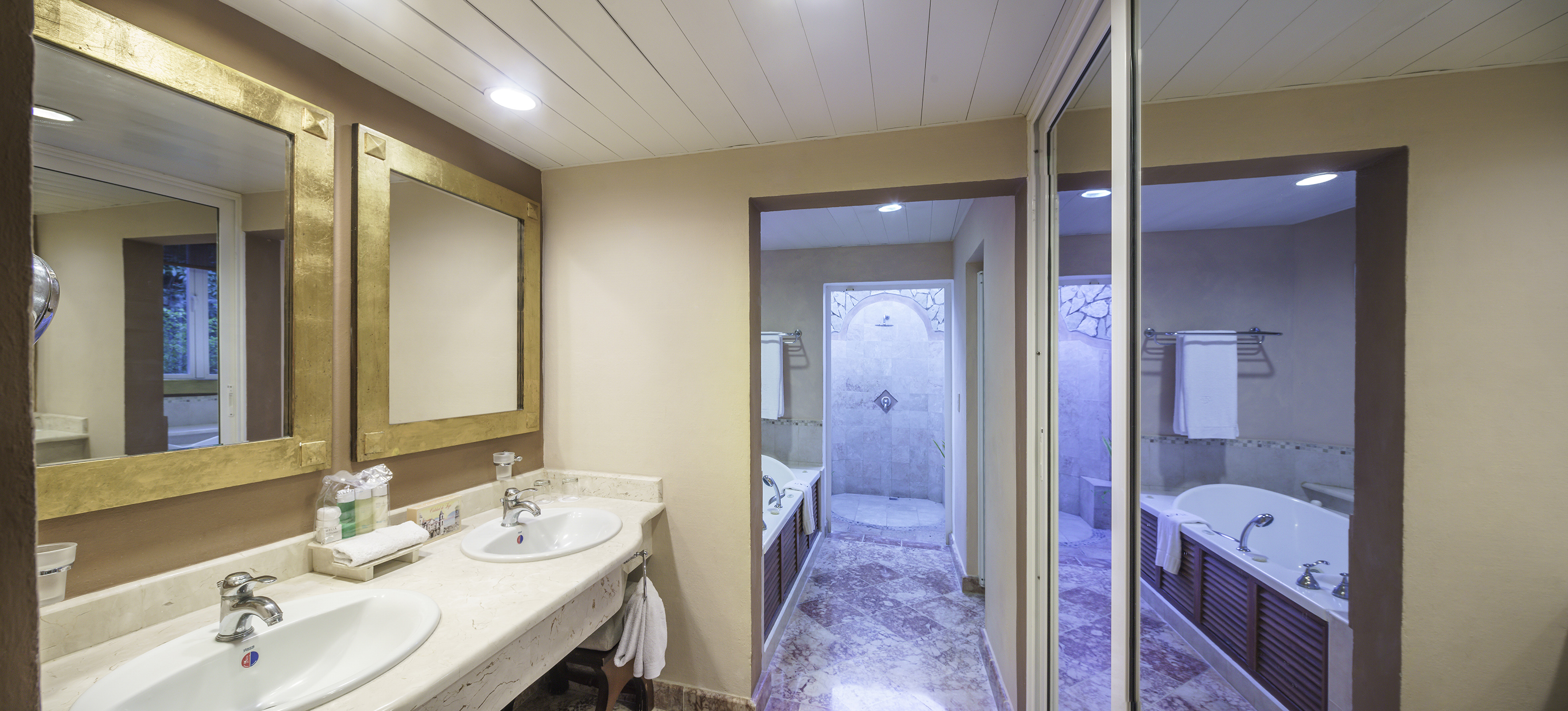 a bathroom with marble floor and sink