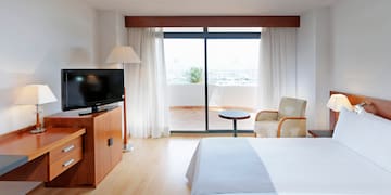 a room with a television and a bed