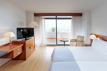 a room with a television and a bed