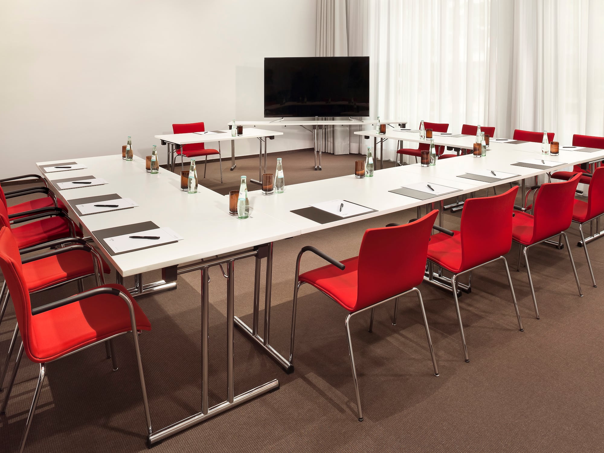 a room with a television and tables