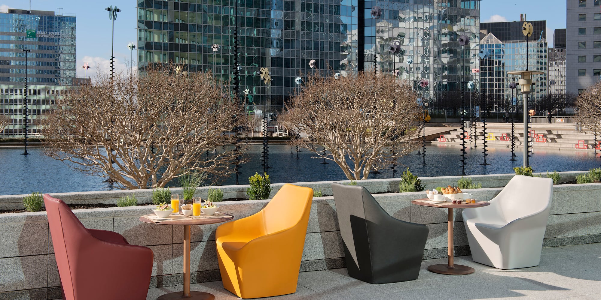a group of chairs and tables outside