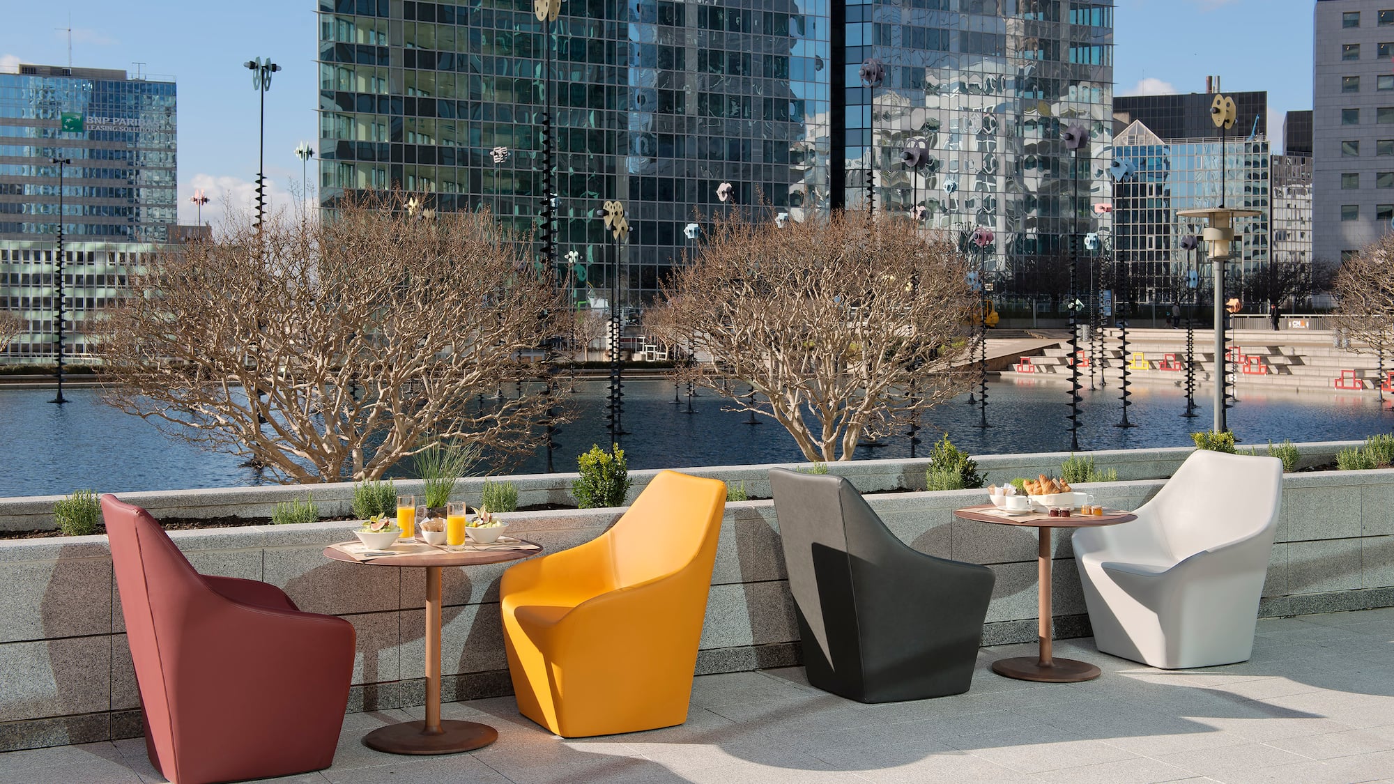 a group of chairs and tables outside