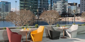 a group of chairs and tables outside
