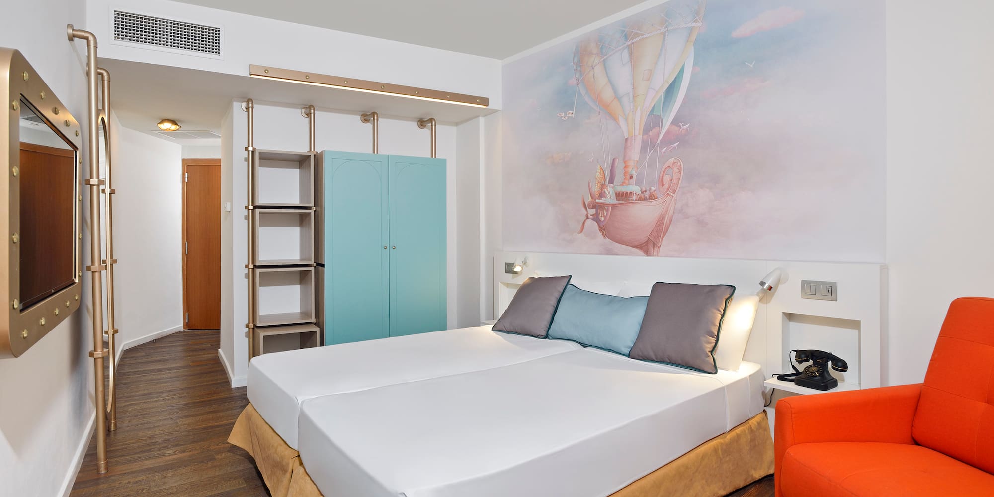 a bed with a picture on the wall