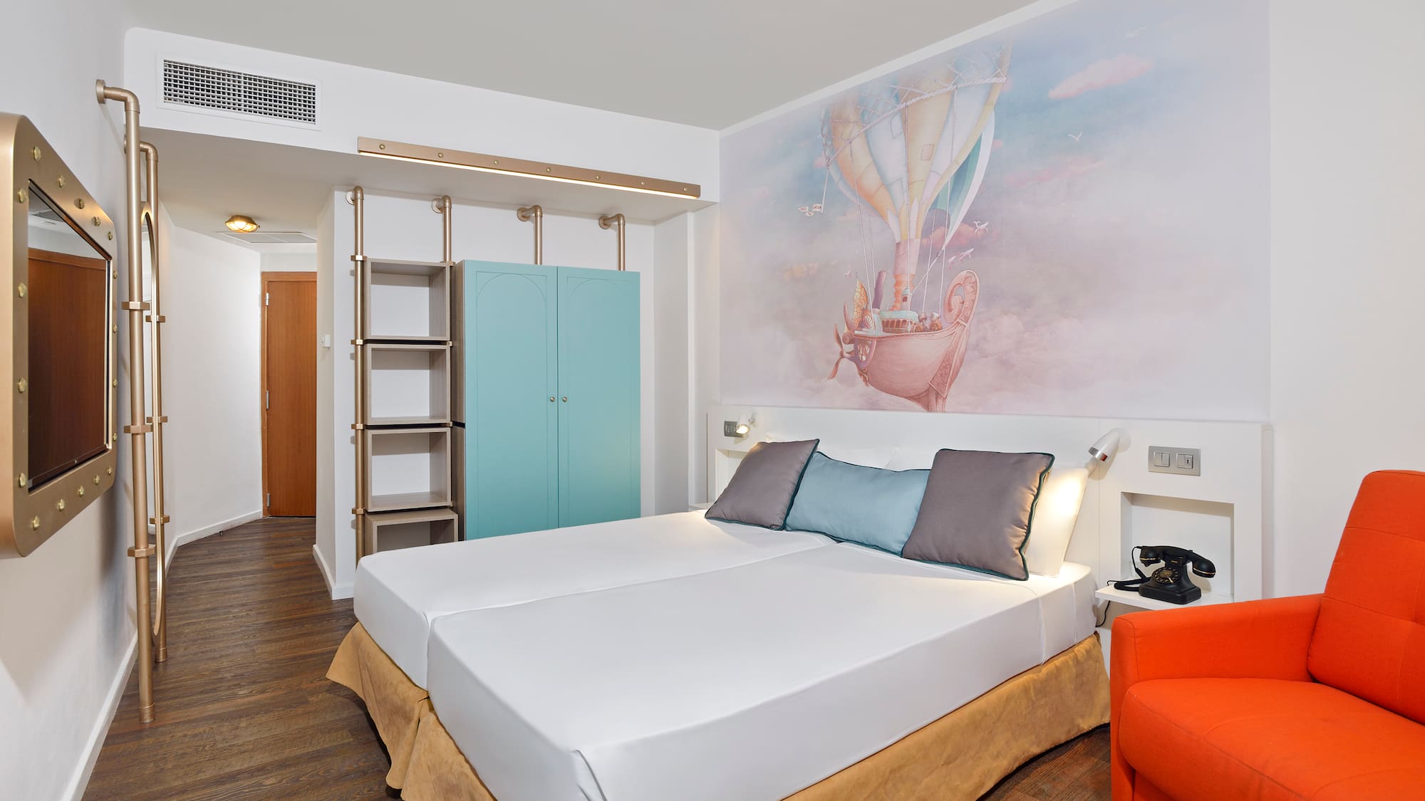 a bed with a picture on the wall