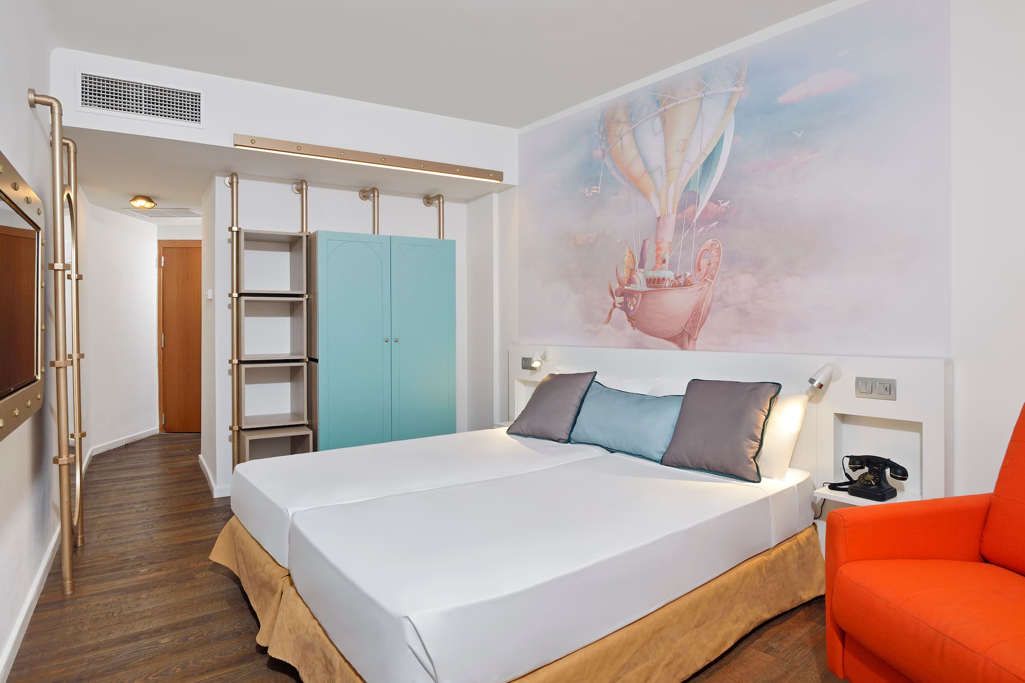 a bed with a picture on the wall