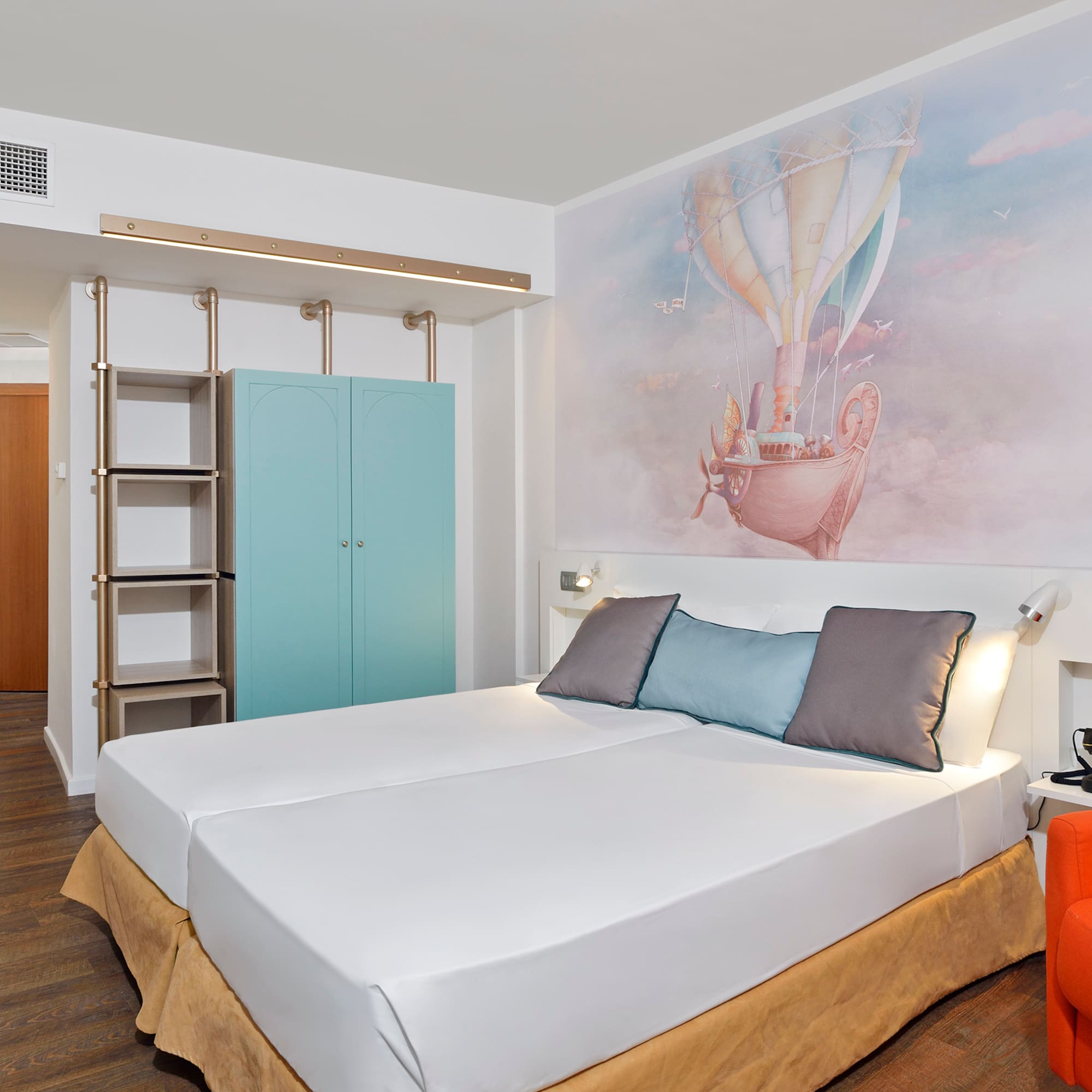 a bed with a picture on the wall
