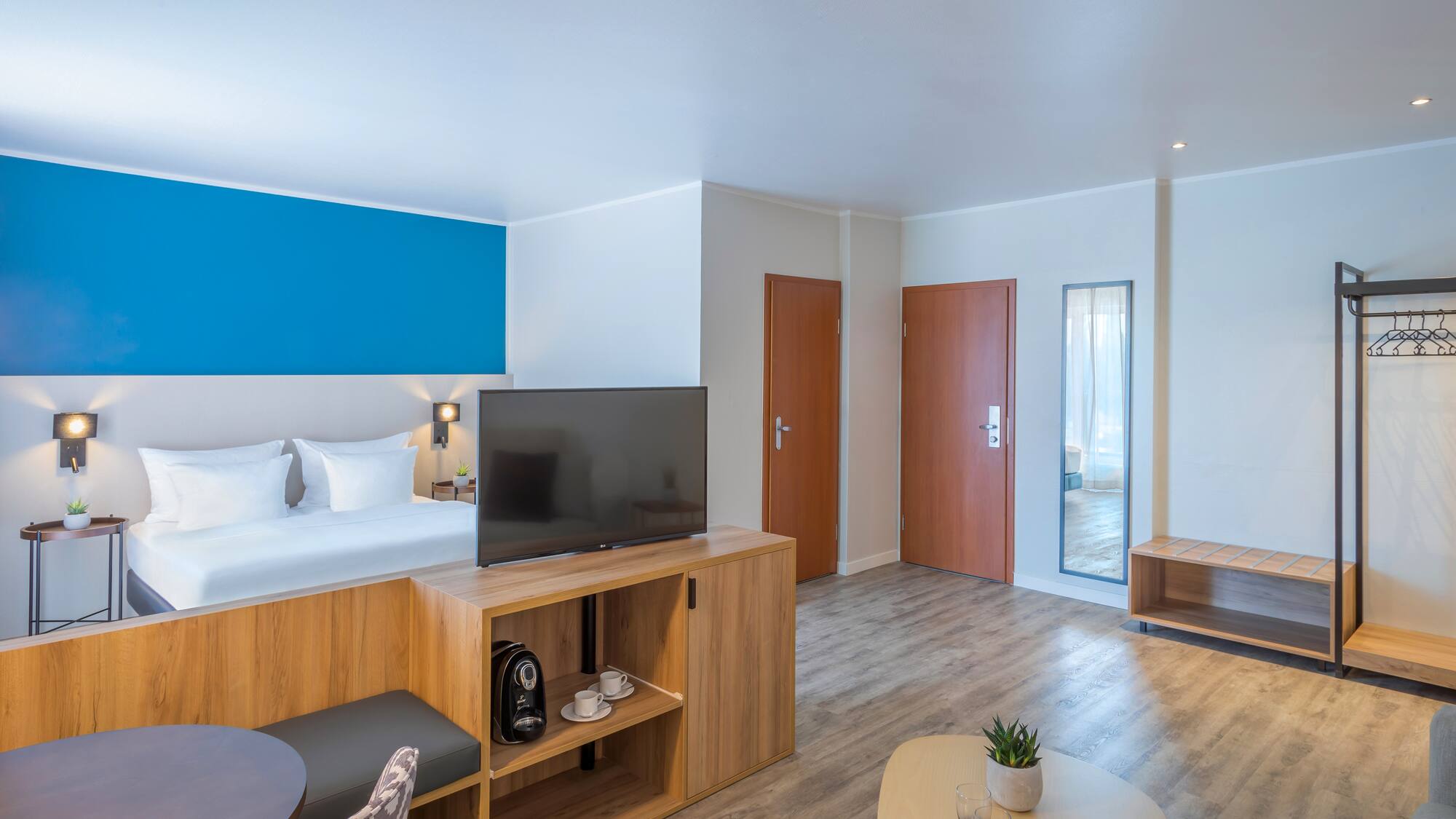 a room with a tv and a bed