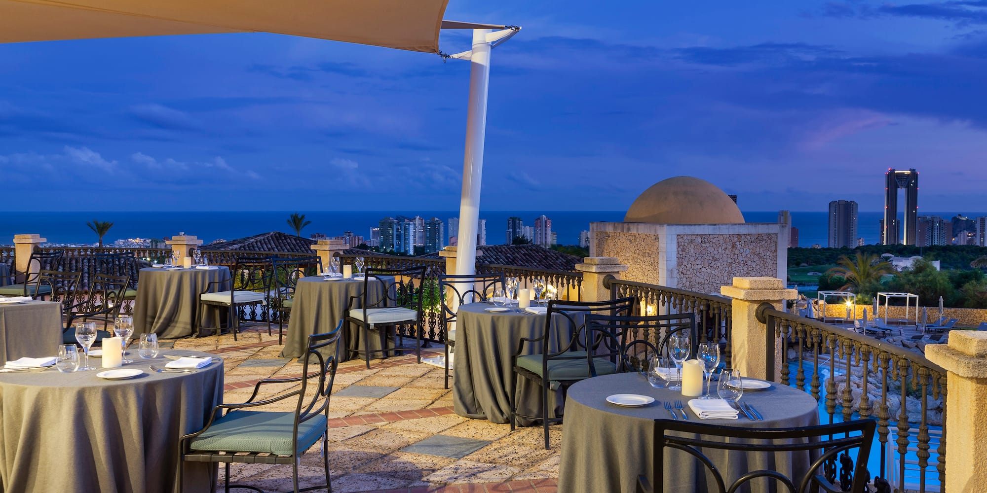 a restaurant with tables and chairs on a patio