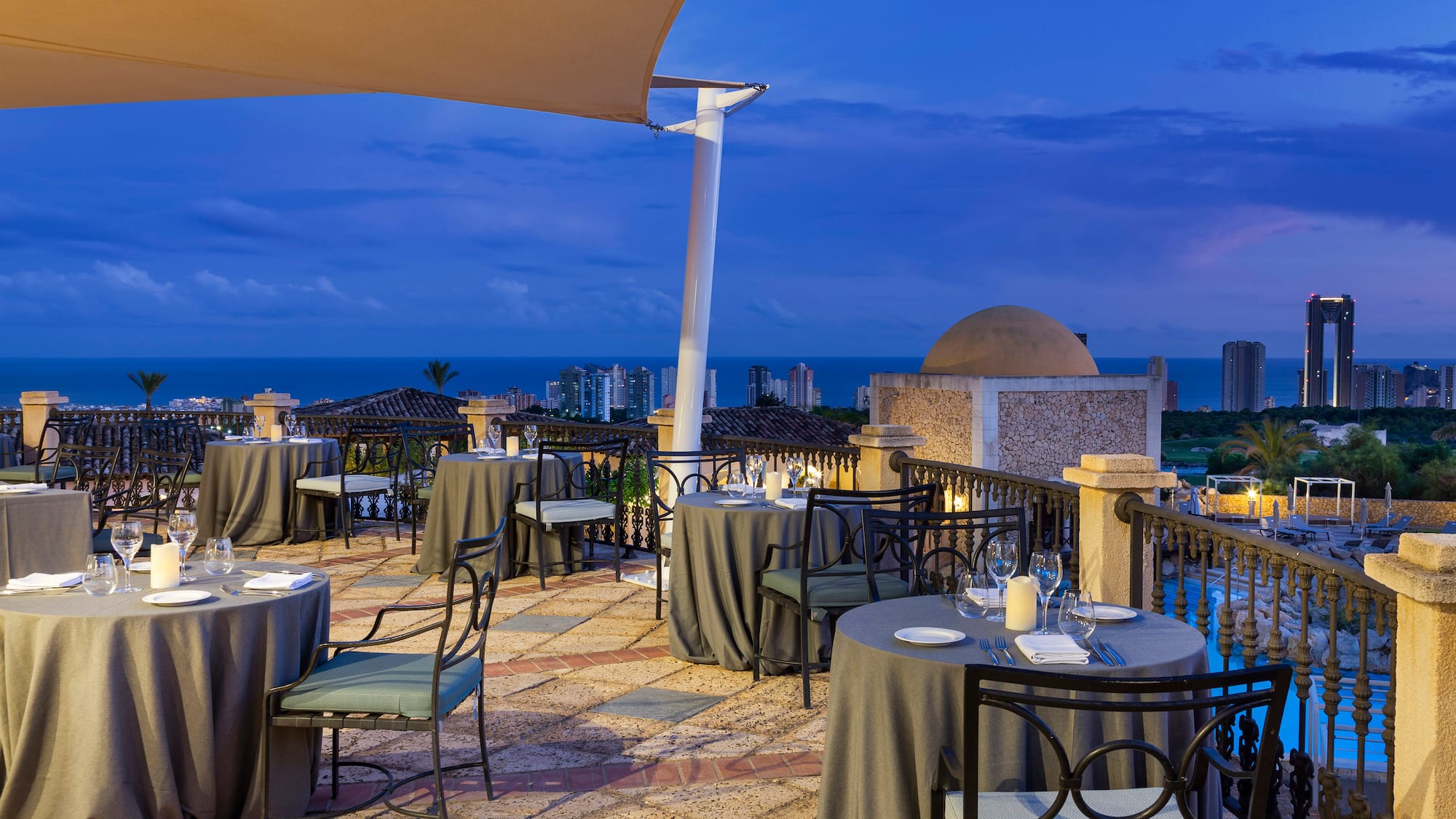 a restaurant with tables and chairs on a patio