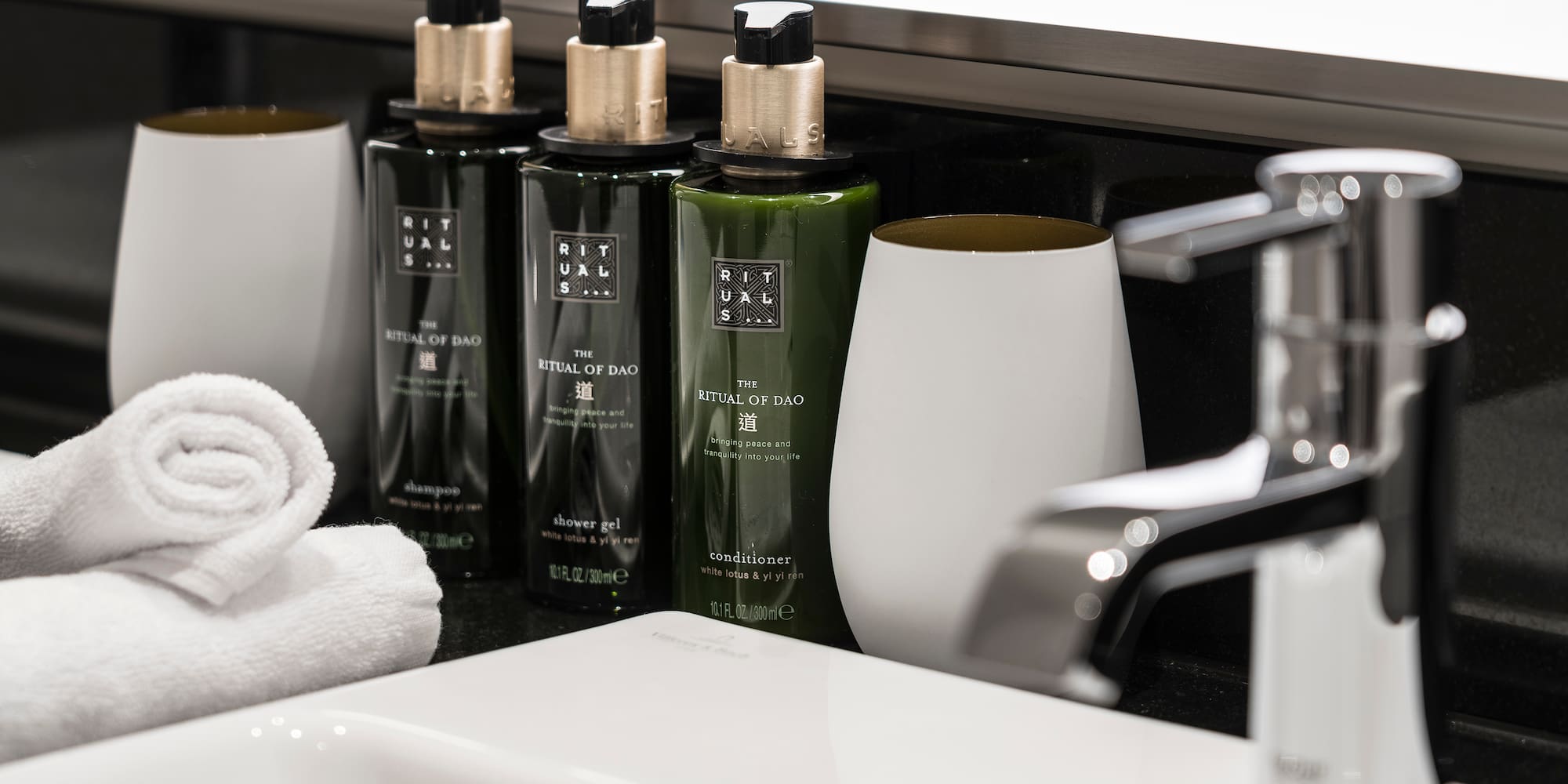 a group of bottles and a towel on a counter