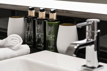 a group of bottles and a towel on a counter