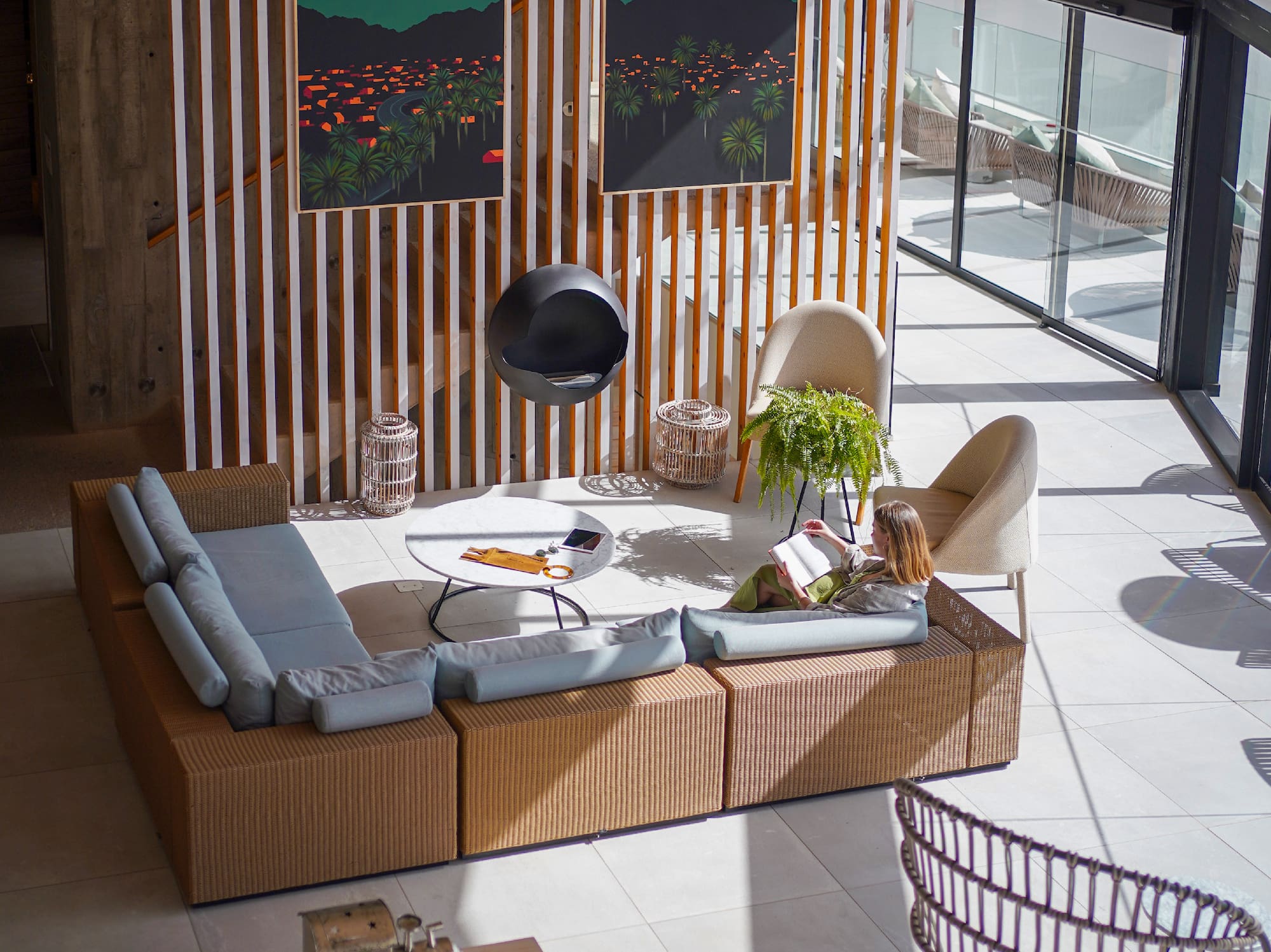 a room with a couch and chairs