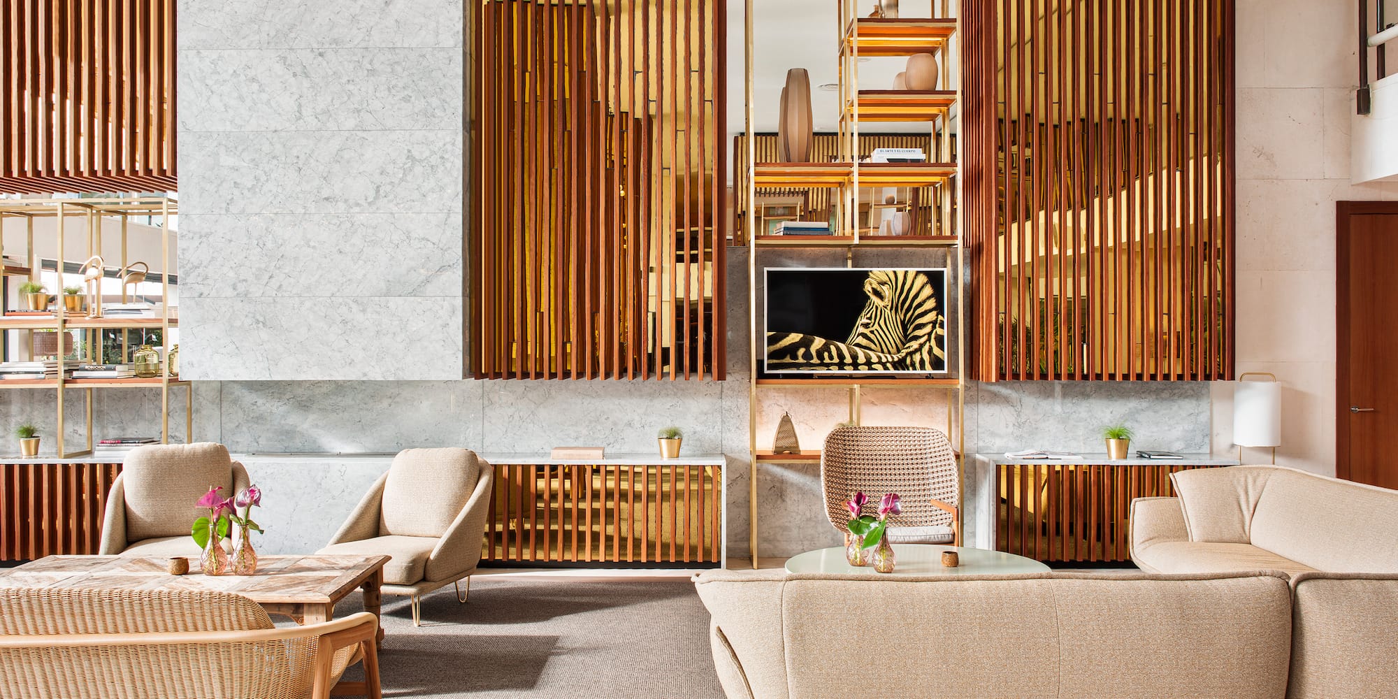 a room with a couch and chairs