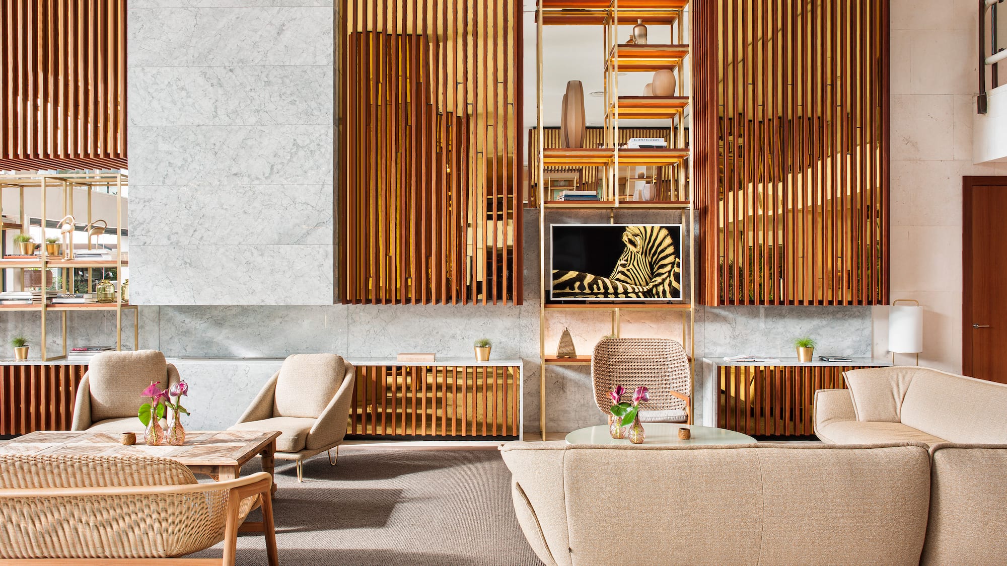 a room with a couch and chairs