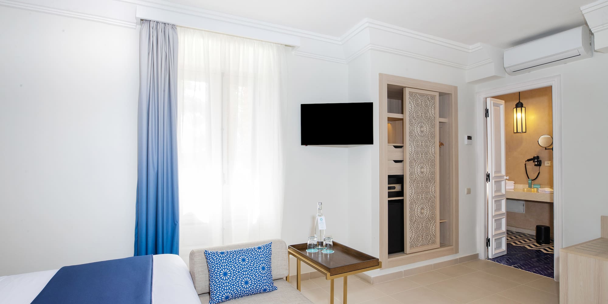 a room with a bed and a tv