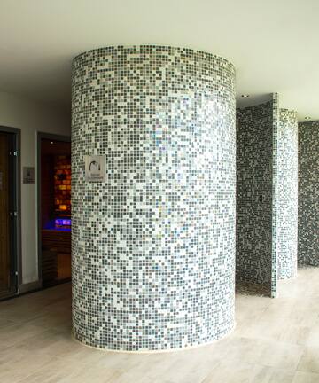 a room with a mosaic wall