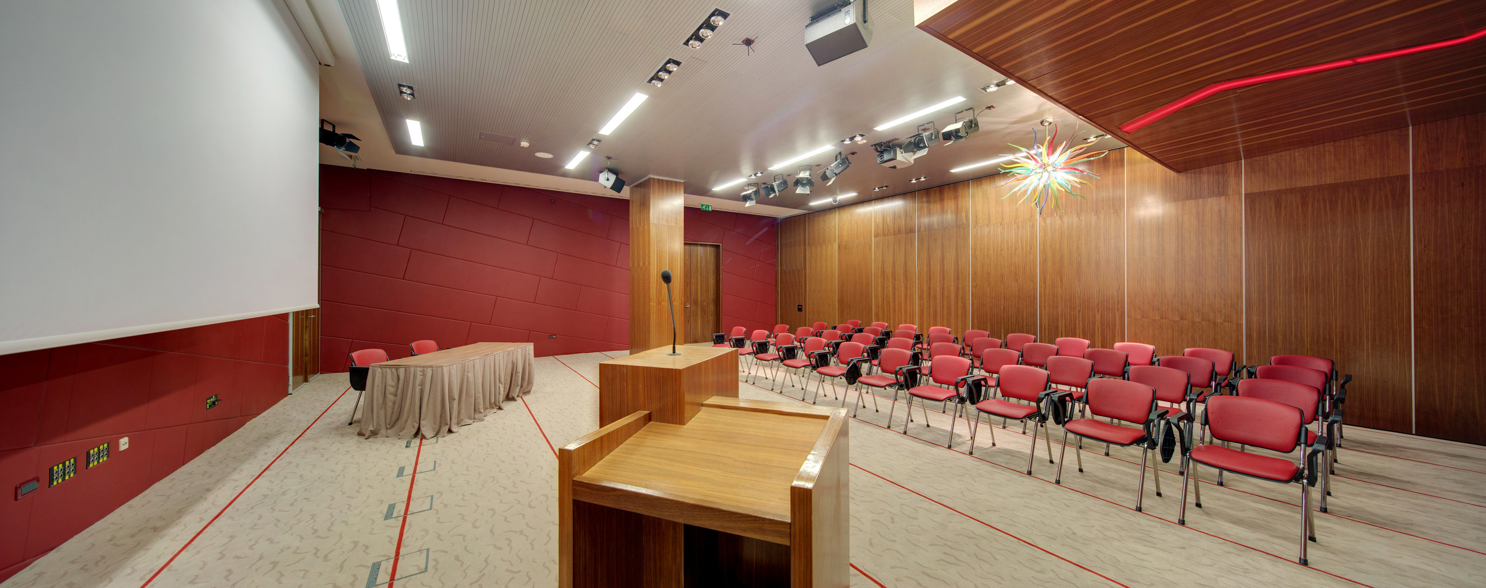 a room with a podium and chairs