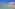 a beach with people and water with Clearwater Beach in the background