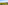 Coastal city panorama: green trees, urban buildings, and clear blue sea
