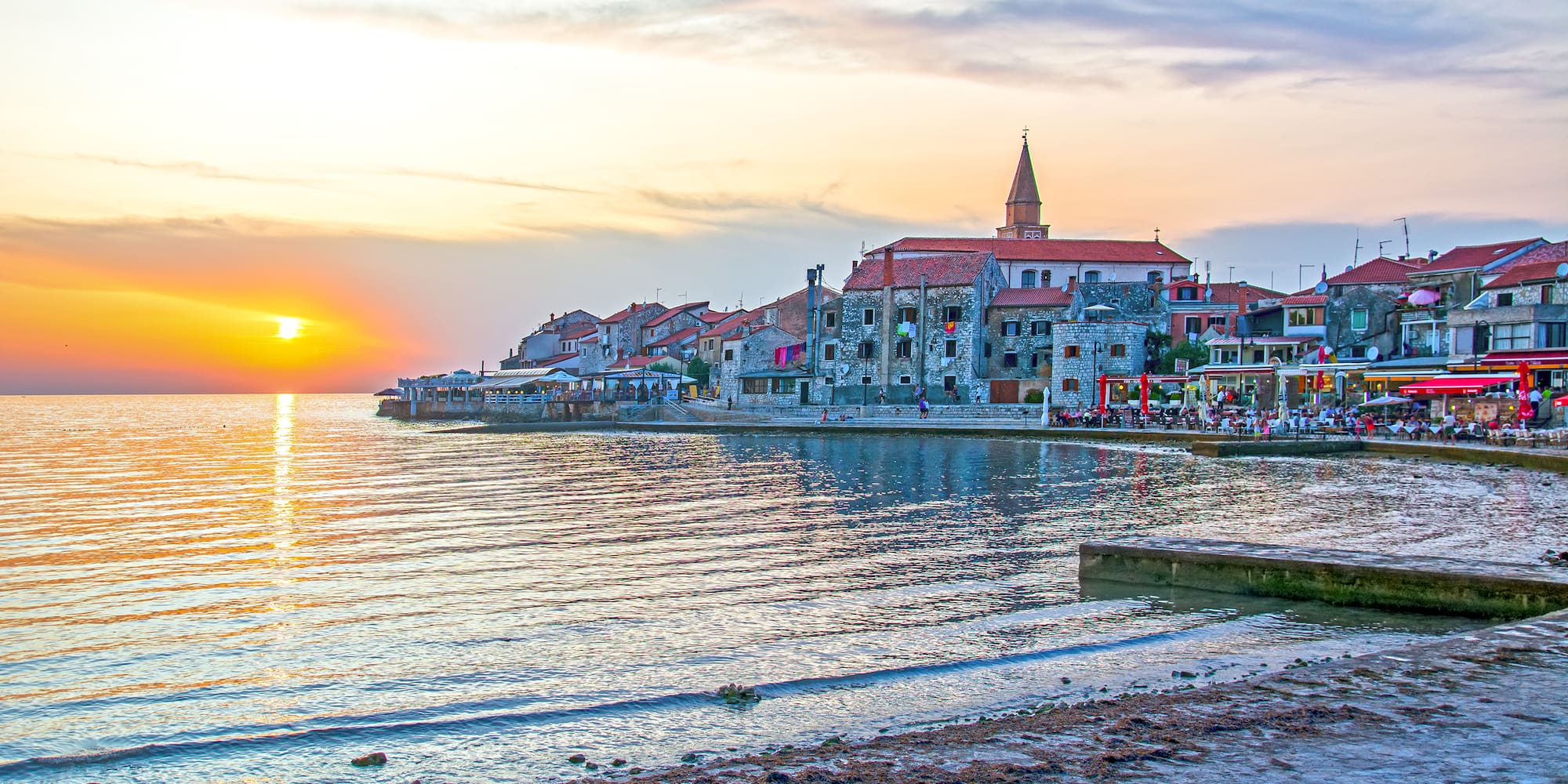 a sunset over a body of water