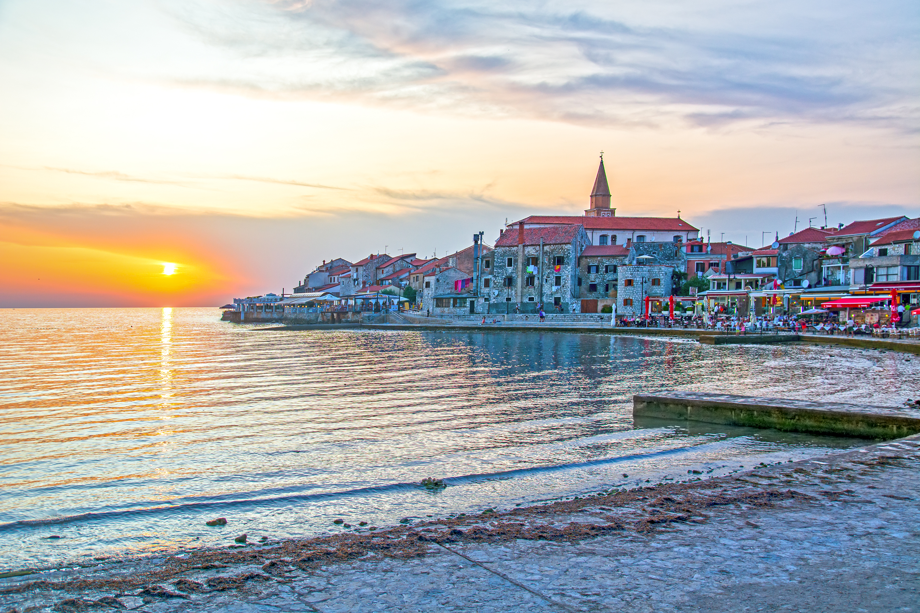a sunset over a body of water