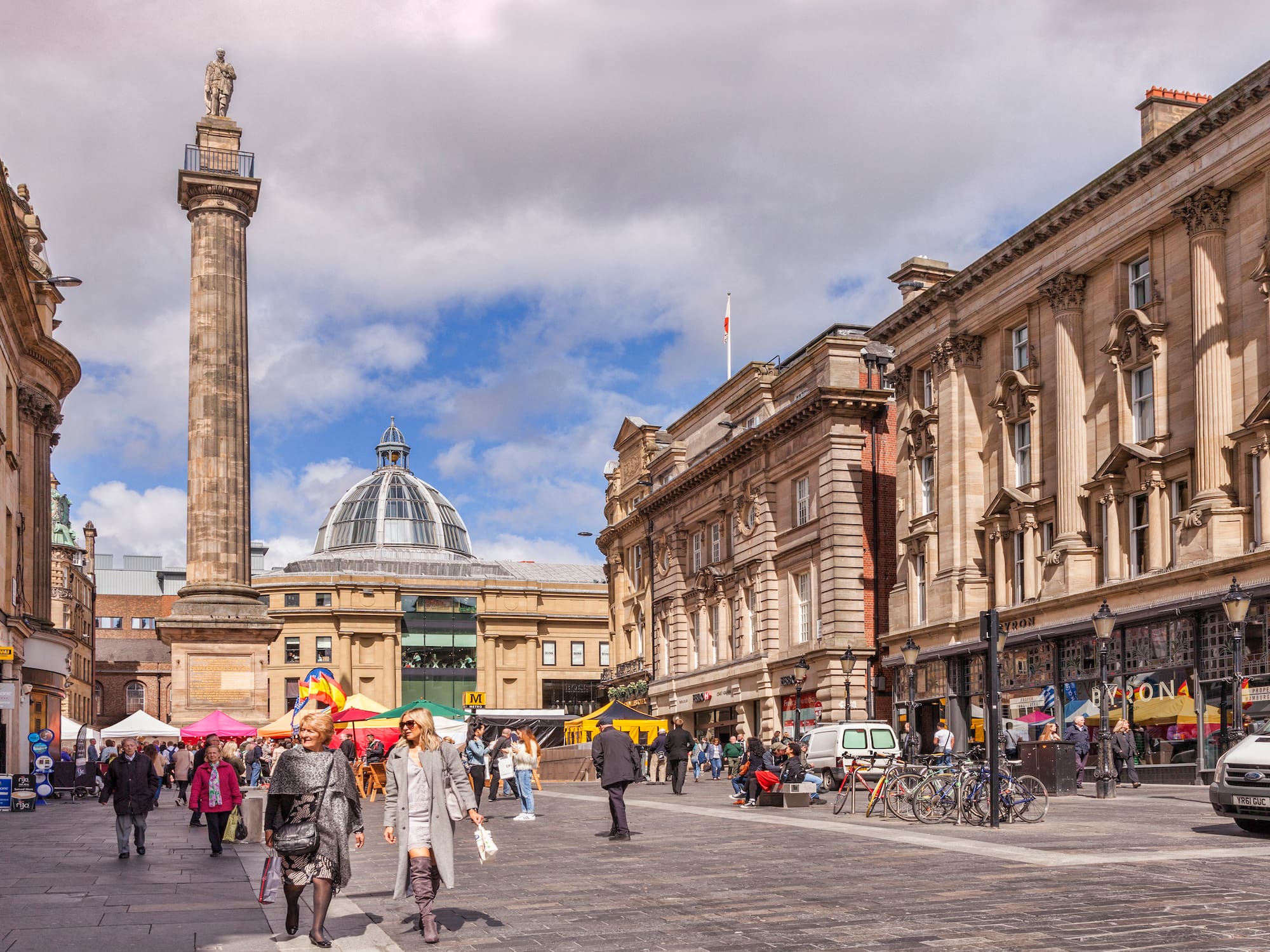 a group of people walking in a city